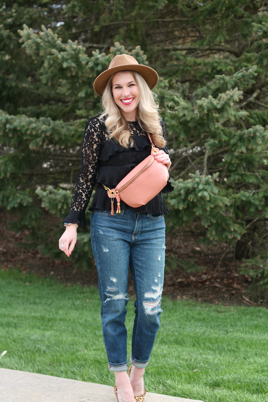 date night outfit with pink belt bag, black lace pleated blouse, camel hat, distressed straight leg jeans, leopard heels 