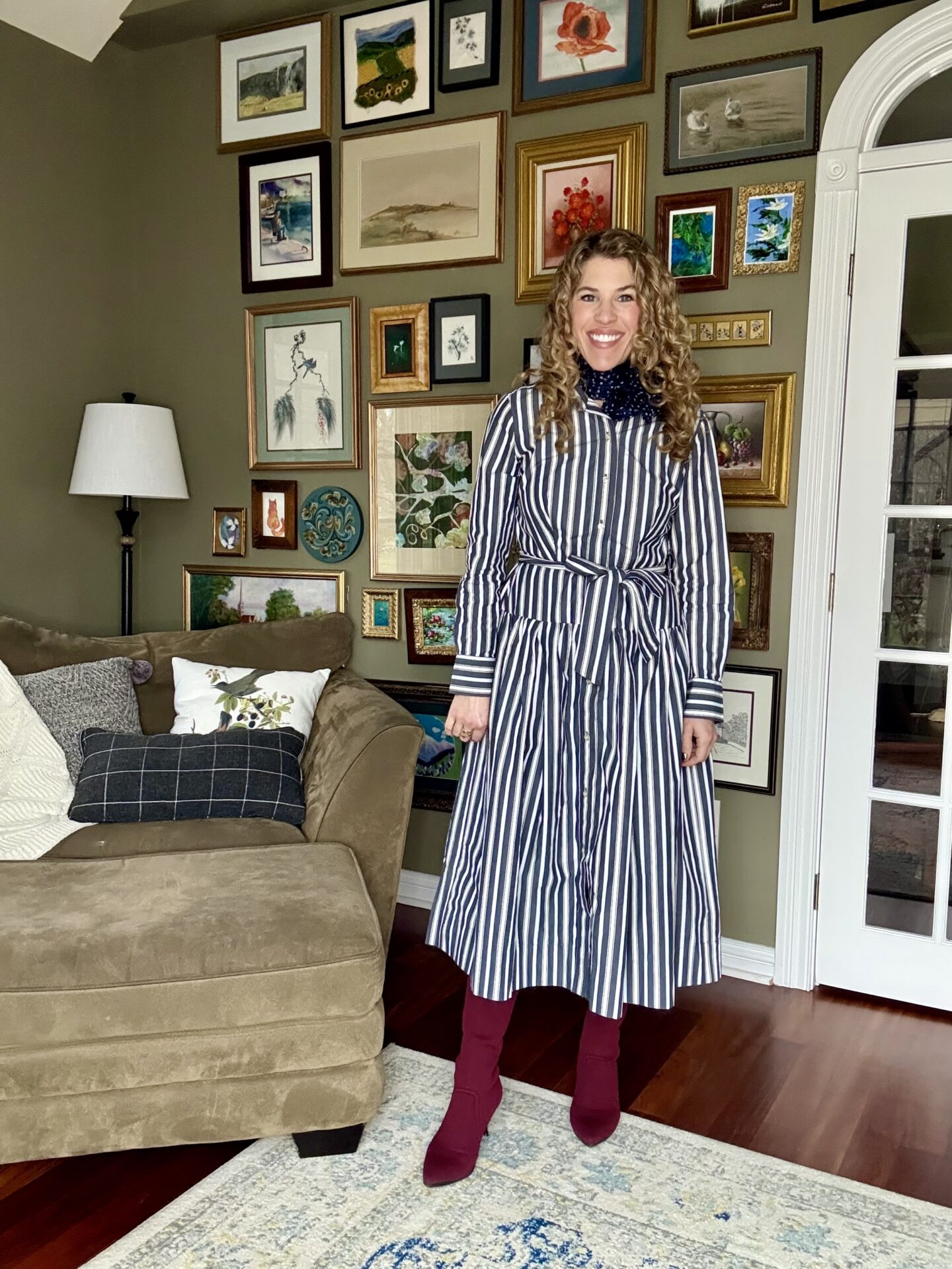 Striped shirtdress styled with burgundy boots for winter.